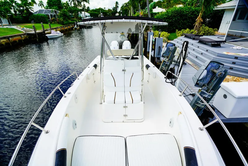 Slide: The Image of 1999 Century 2600 CC boat docked on a calm canal, surrounded by lush greenery. - 4