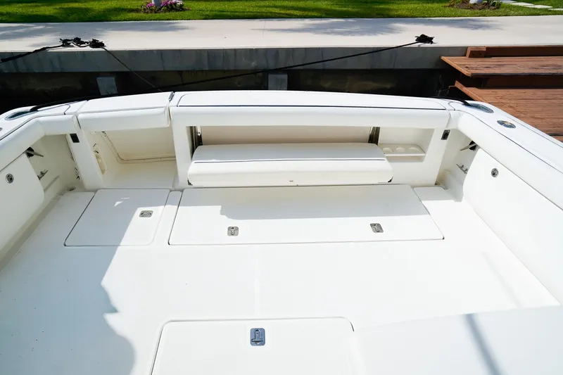 Slide: The Image of 2005 Tiara Yachts 3800 Open boat deck with seating and storage compartments. - 12
