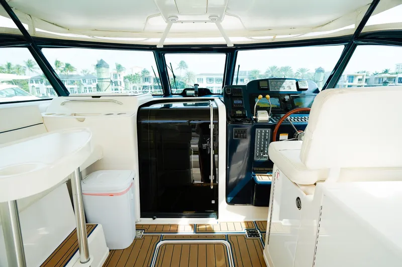 Slide: The Image of 2005 Tiara Yachts 3800 Open cockpit with modern controls and luxurious seating. - 18