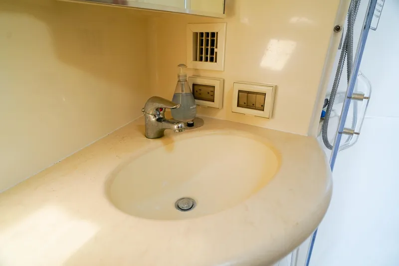 Slide: The Image of 2005 Tiara Yachts 3800 Open bathroom sink with faucet and soap dispenser. - 36