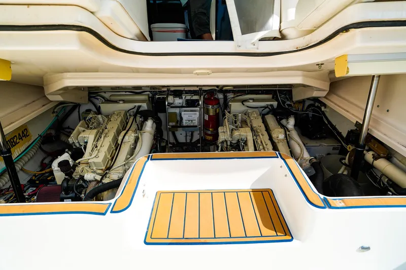 Slide: The Image of Engine compartment of a 2005 Tiara Yachts 3800 Open, showcasing dual engines and equipment. - 43