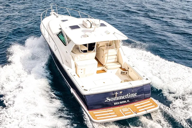 Slide: The Image of 2005 Tiara Yachts 3800 Open cruising on the ocean, rear view. - 8