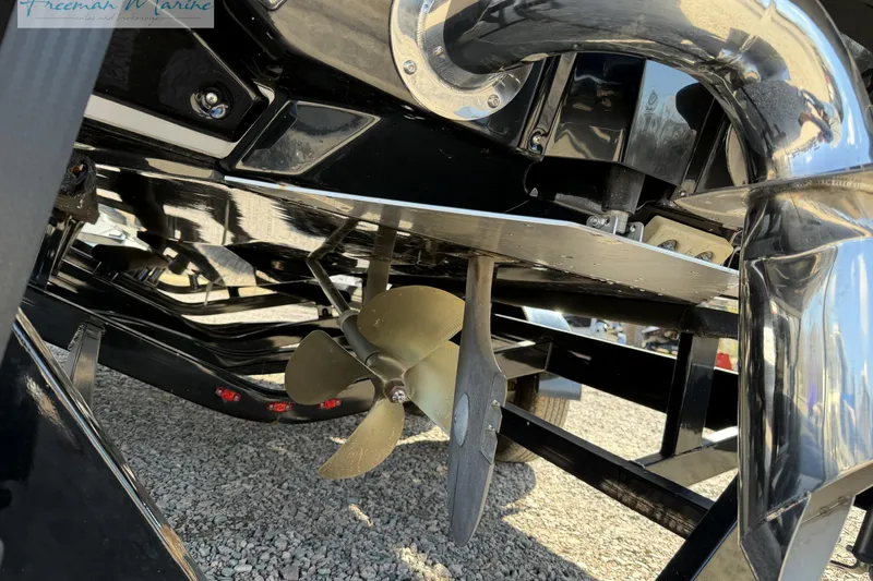 Slide: The Image of 2022 Nautique Super Air Nautique G23 boat exhaust and propeller detail. - 12