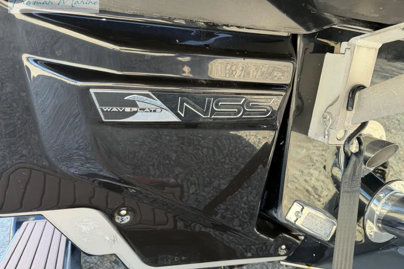 Slide: The Image of 2022 Nautique Super Air Nautique G23 Coastal Edition badge on boat exterior. - 14