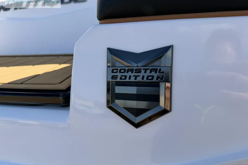 Slide: The Image of 2022 Nautique Super Air Nautique G23 boat on trailer, blue and white design. - 15