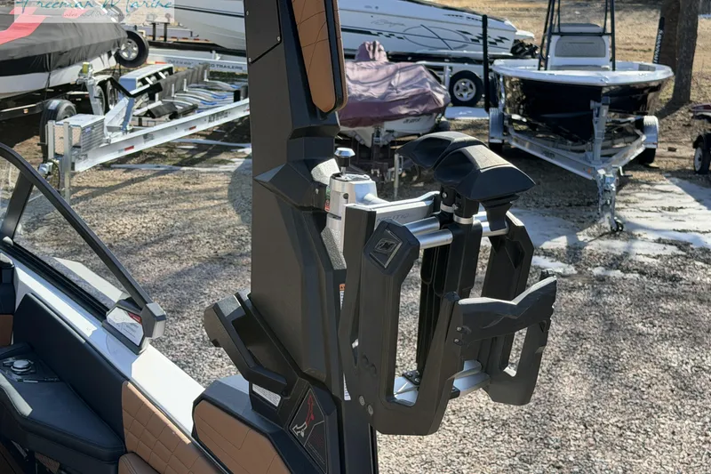Slide: The Image of 2022 Nautique Super Air Nautique G23 wakeboard rack detail, outdoor setting. - 24