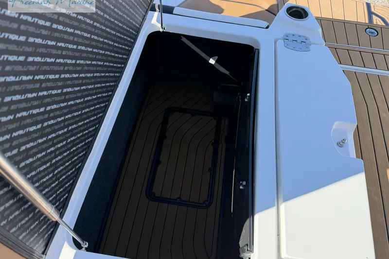 Slide: The Image of 2022 Nautique Super Air Nautique G23 engine compartment with PCM marine engine. - 27