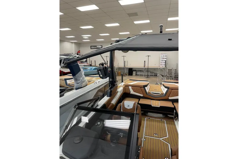 Slide: The Image of 2022 Nautique Super Air Nautique G23 boat cruising on a sunny lake. - 3