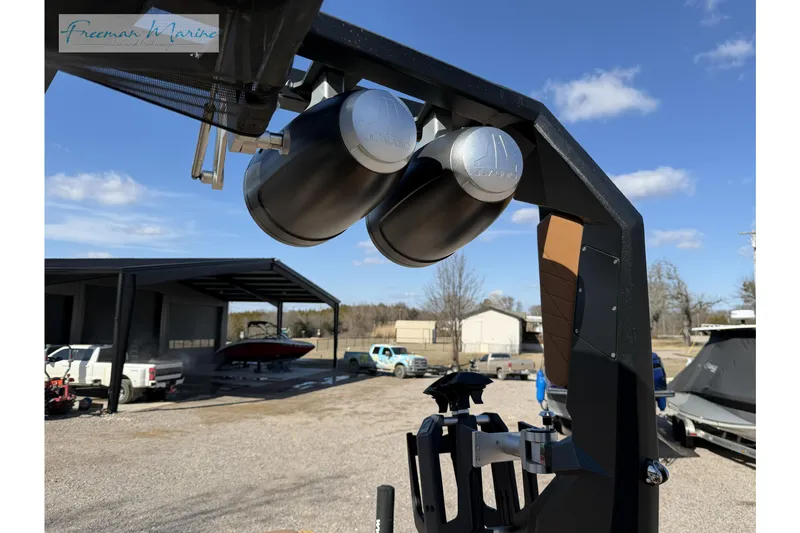 Slide: The Image of 2022 Nautique Super Air Nautique G23 with JL Audio speakers, outdoor setting. - 39