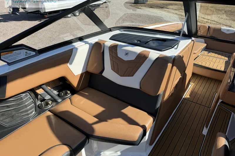 Slide: The Image of 2022 Nautique Super Air Nautique G23 interior with sleek steering and modern dashboard design. - 43