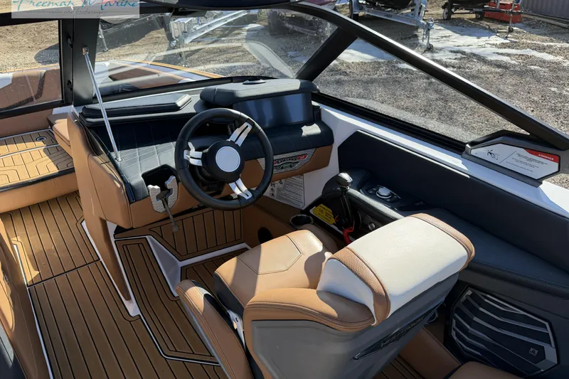 Slide: The Image of Interior controls of 2022 Nautique Super Air Nautique G23 boat, featuring sleek design and functionality. - 44