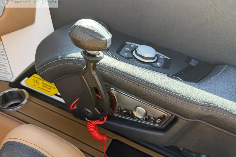 Slide: The Image of 2022 Nautique Super Air Nautique G23 dashboard with touchscreen and control buttons. - 45