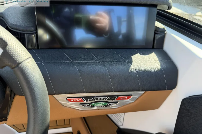 Slide: The Image of Helm panel of 2022 Nautique Super Air Nautique G23 with wood accents. - 46