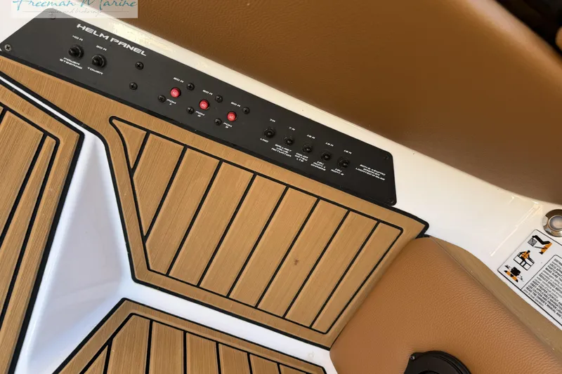 Slide: The Image of 2022 Nautique Super Air Nautique G23 boat interior with audio controls. - 47