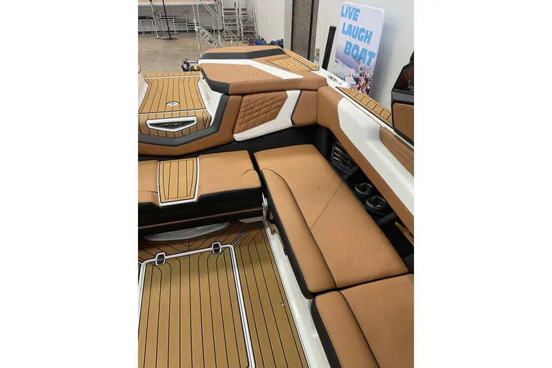 Slide: The Image of 2022 Nautique Super Air Nautique G23 boat on trailer, blue and white design. - 5