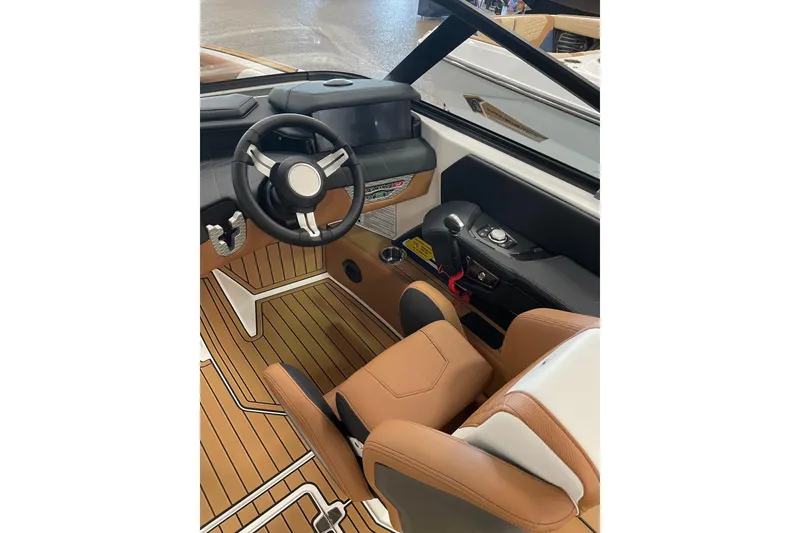 Slide: The Image of 2022 Nautique Super Air Nautique G23 boat rear view with teak deck and seating. - 7