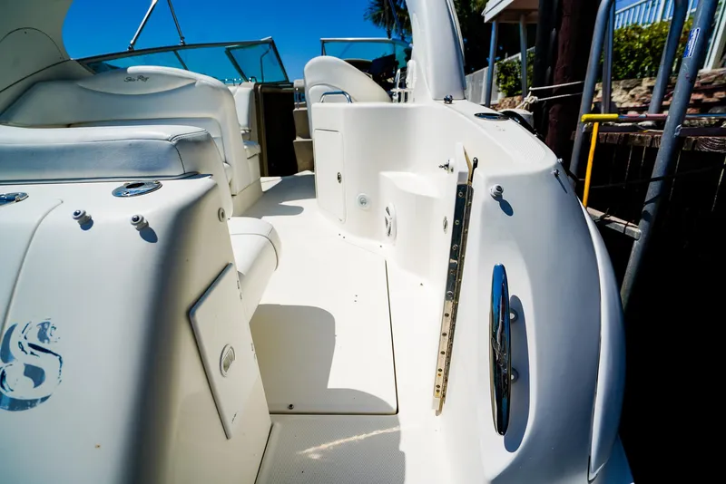 Slide: The Image of 2007 Sea Ray 280 Sundancer boat interior with white seating and deck. - 8