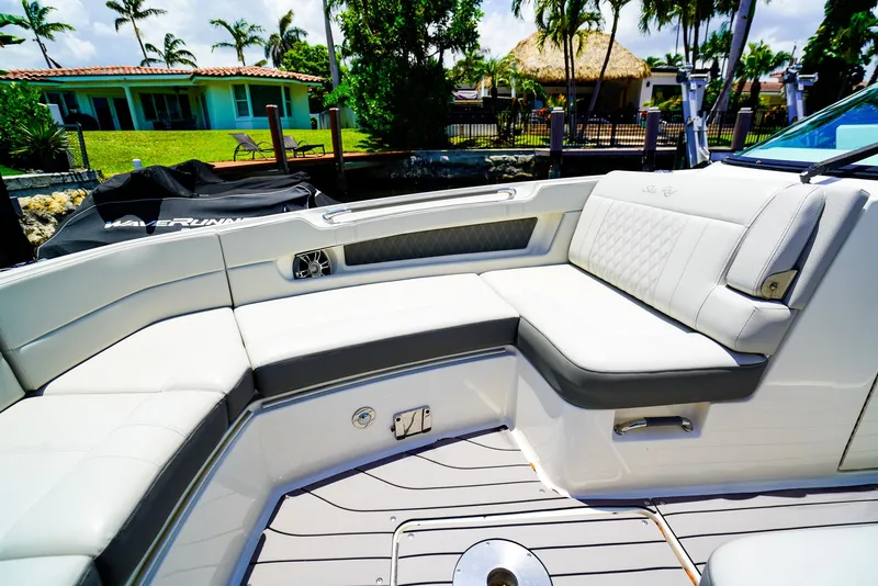 Slide: The Image of Luxurious seating on 2022 Sea Ray SLX 310 OB boat, featuring elegant design and comfort. - 23