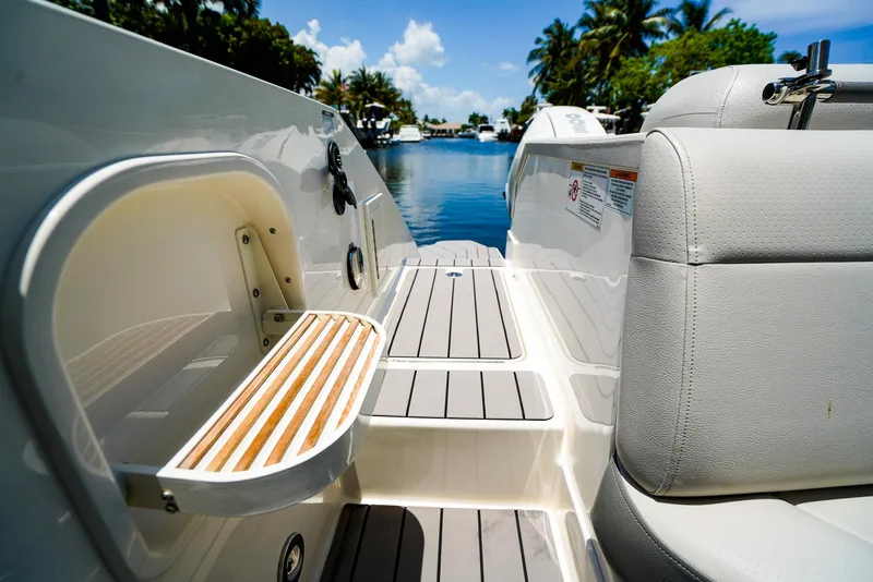 Slide: The Image of 2022 Sea Ray SLX 310 OB boat interior with seating and deck view. - 9