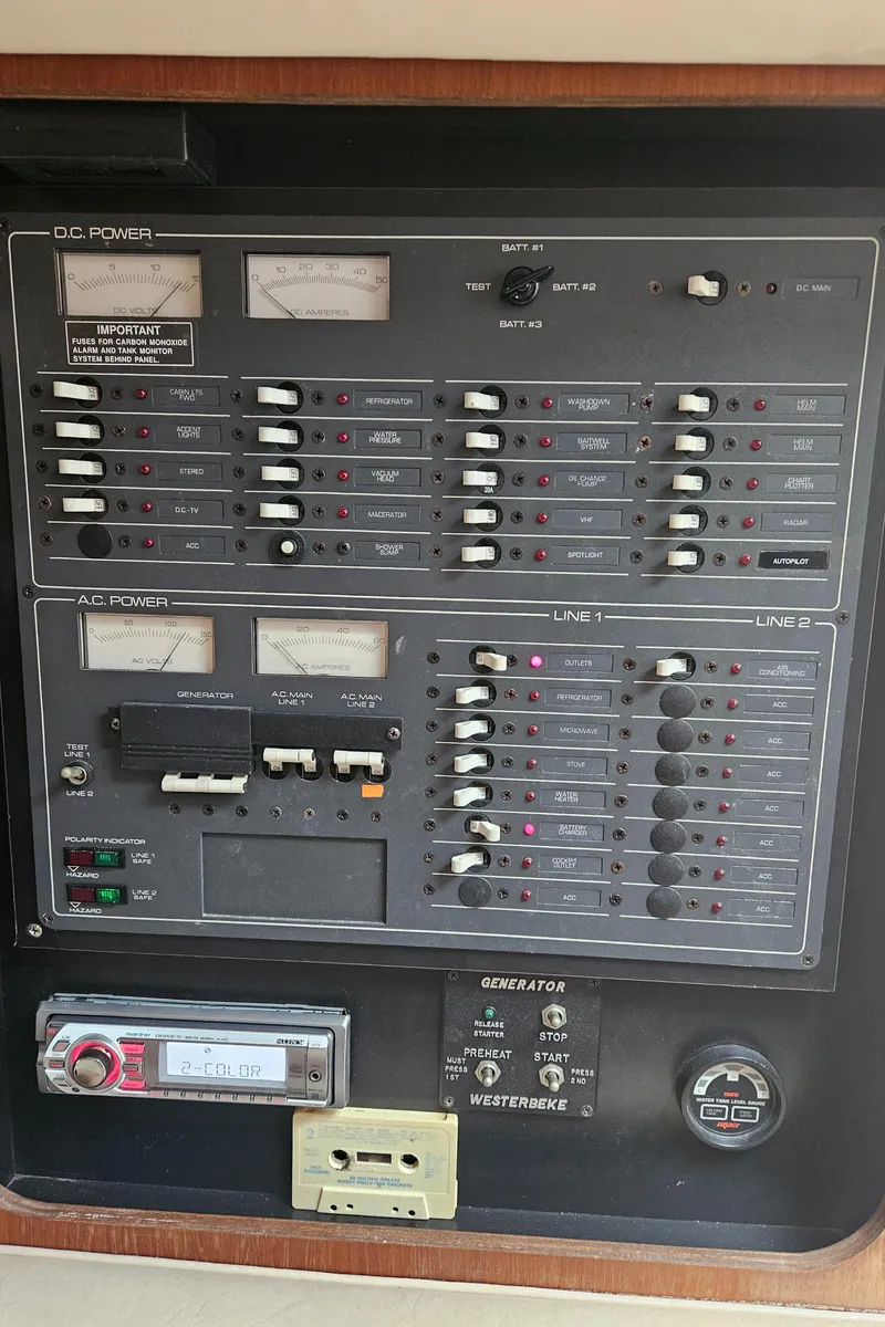 Slide: The Image of Electrical control panel on a 1996 Tiara Yachts 3100 EXPRESS boat. - 18