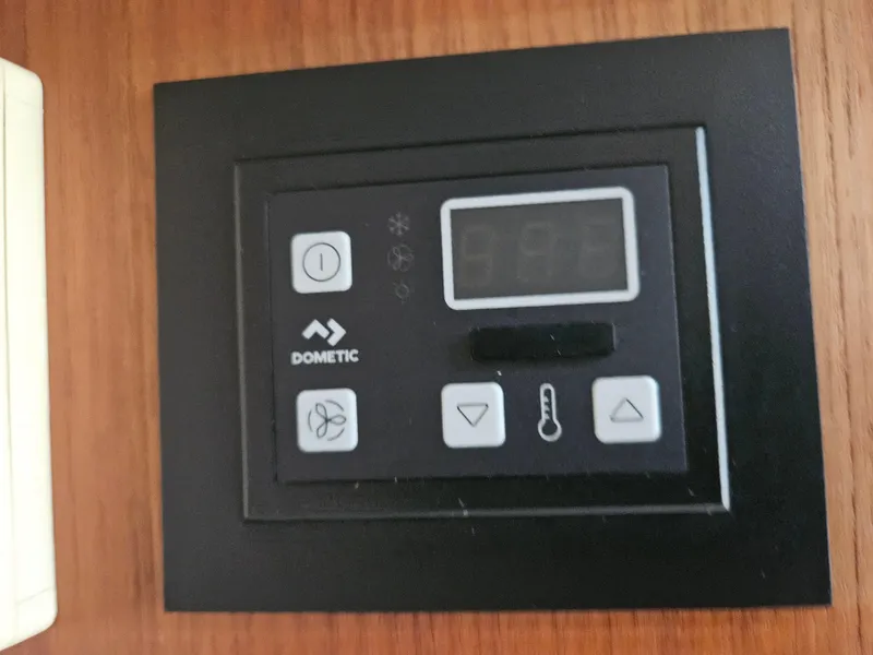 Slide: The Image of Dometic control panel on 1996 Tiara Yachts 3100 EXPRESS, featuring temperature and fan settings. - 22