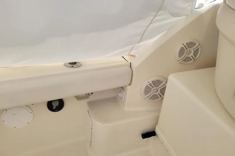 Slide: The Image of Interior view of a 1996 Tiara Yachts 3100 Open, featuring speakers and seating area. - 29