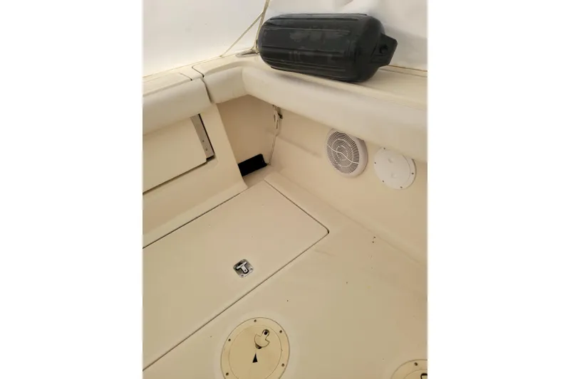 Slide: The Image of 1996 Tiara Yachts 3100 Open interior with storage and speaker details. - 30