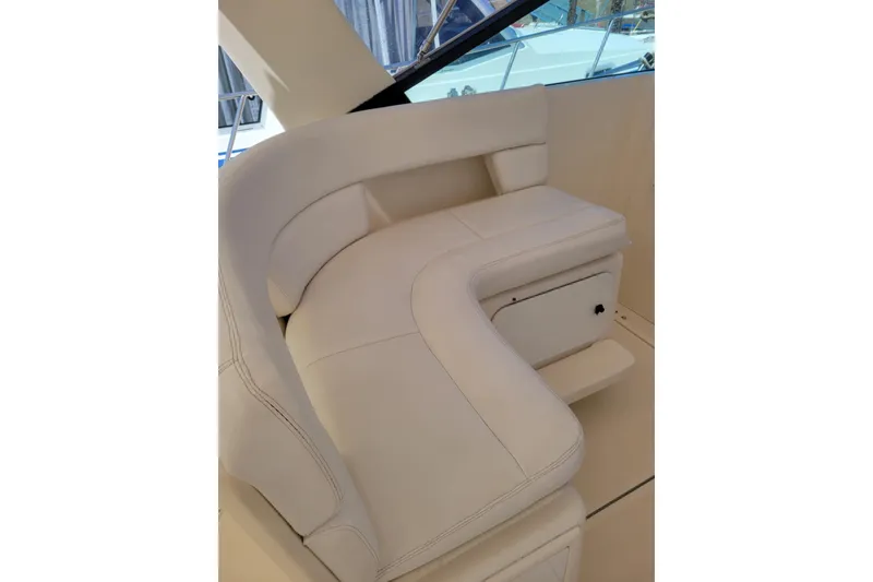 Slide: The Image of White leather seating on 1996 Tiara Yachts 3100 Open, showcasing luxury interior design. - 8