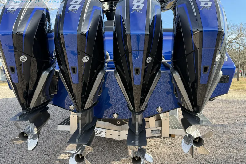 Slide: The Image of 2024 Cigarette 41' Nighthawk with four powerful outboard engines, rear view. - 12