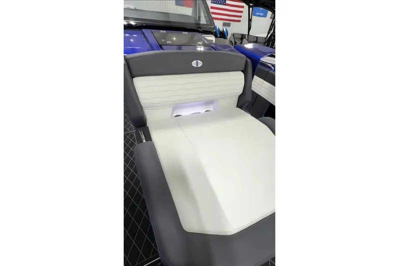 Slide: The Image of 2024 Cigarette 41' Nighthawk luxury seating with sleek design and American flag backdrop. - 24