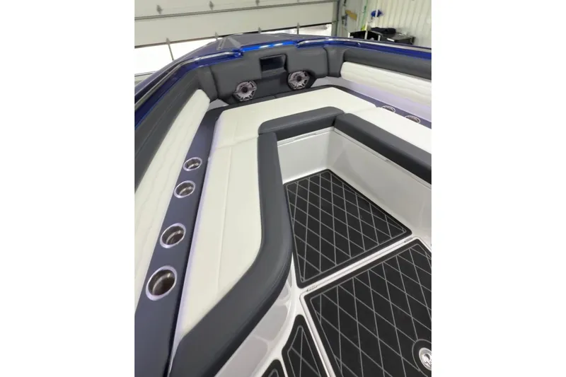 Slide: The Image of 2024 Cigarette 41' Nighthawk boat interior with cushioned seating and sleek design. - 3