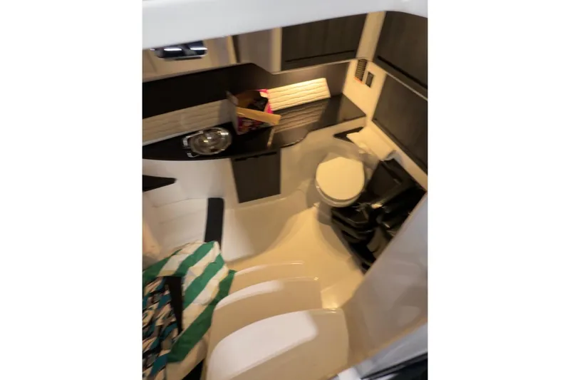 Slide: The Image of 2024 Cigarette 41' Nighthawk cabin interior with modern amenities and sleek design. - 4