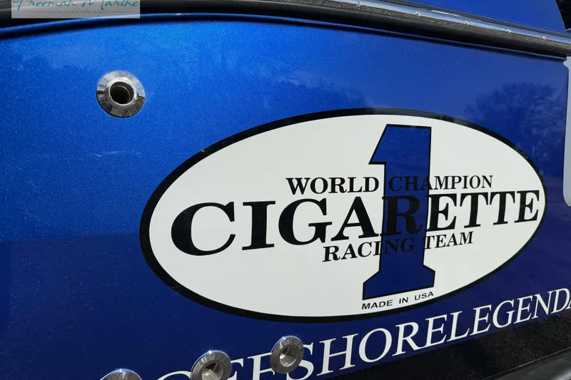 Slide: The Image of 2024 Cigarette 41' Nighthawk boat with "World Champion Racing Team" logo on blue hull. - 9