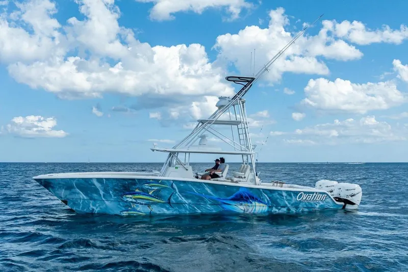 The Image of 2019 Freeman 42LR boat on open sea under blue sky with clouds. - 0