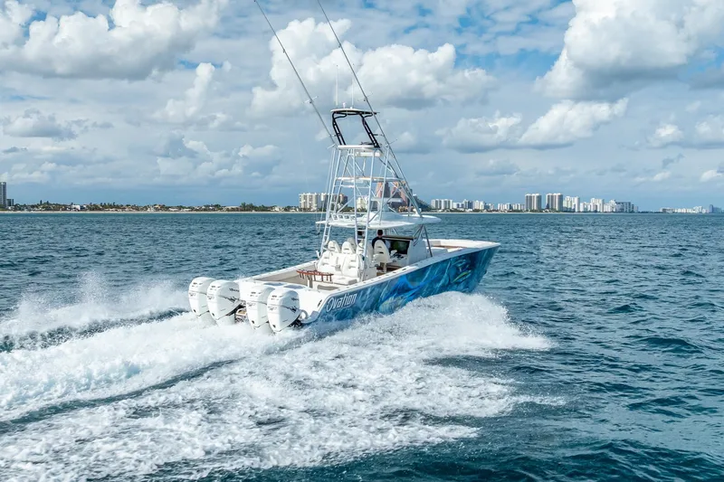 Slide: The Image of 2019 Freeman 42LR boat cruising on open ocean under blue sky. - 10