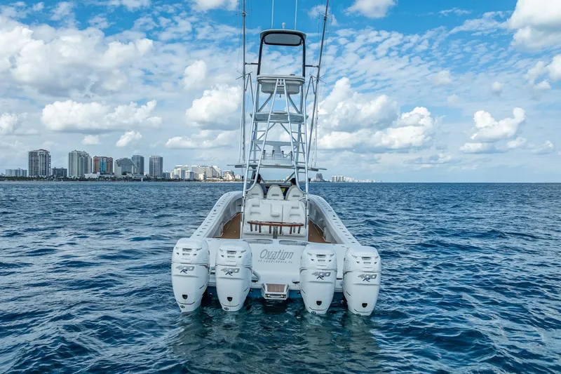 Slide: The Image of Aerial view of a 2019 Freeman 42LR boat docked at a wooden pier. - 3