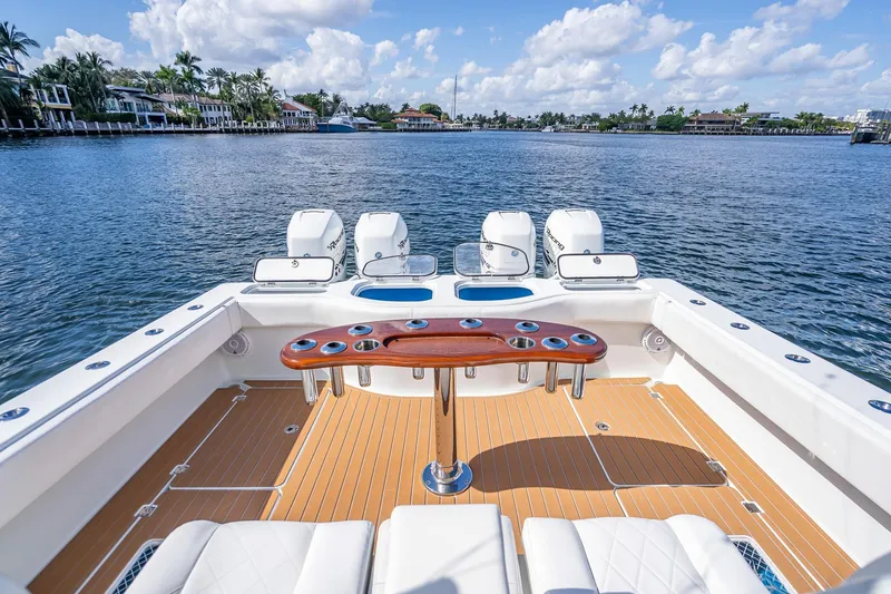 Slide: The Image of 2019 Freeman 42LR boat interior with white seating and wooden deck. - 31