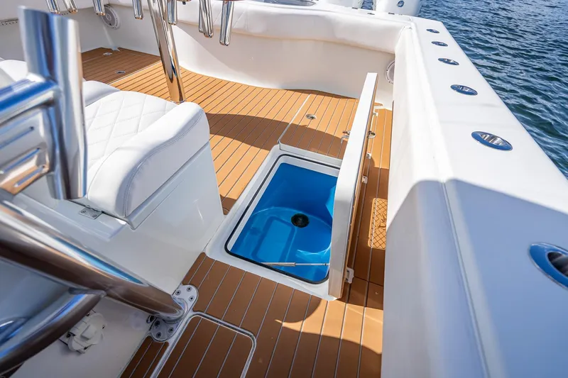 Slide: The Image of 2019 Freeman 42LR boat with luxurious seating, cruising on a scenic waterway. - 37