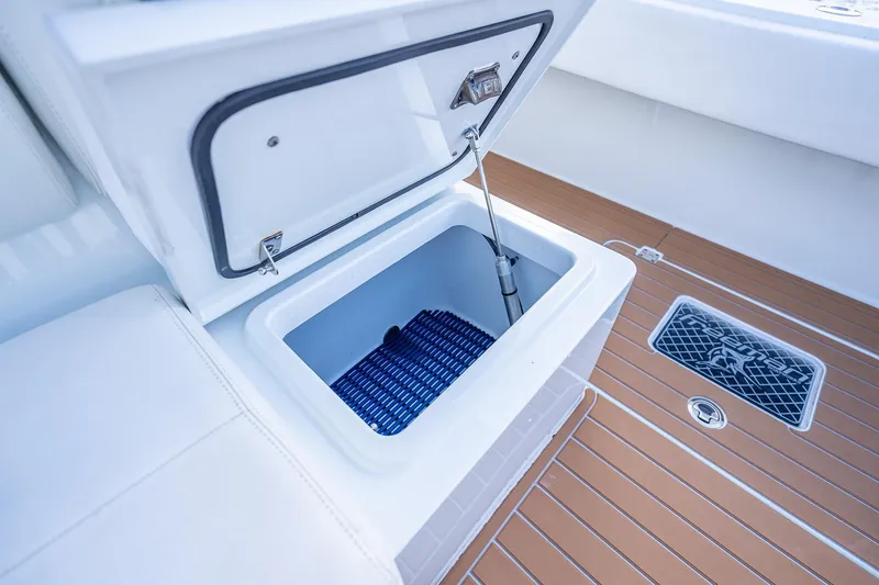 Slide: The Image of 2019 Freeman 42LR boat interior with open storage compartment on teak deck. - 40