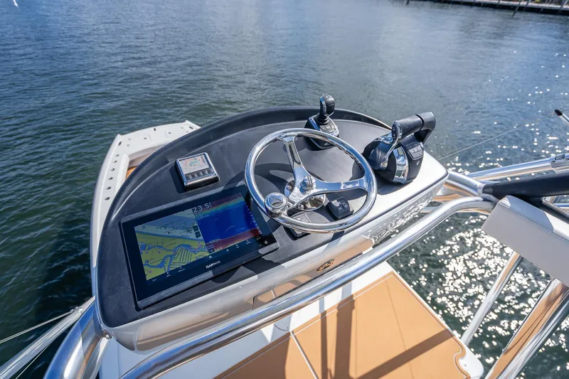 Slide: The Image of Interior view of a 2019 Freeman 42LR boat, featuring a speaker and measurement guide. - 44