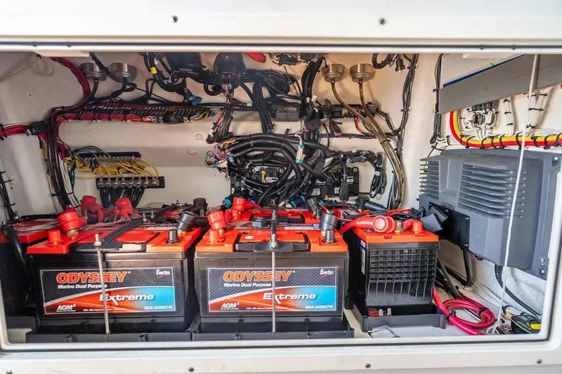 Slide: The Image of Electrical compartment of a 2019 Freeman 42LR with Odyssey marine batteries and wiring. - 51
