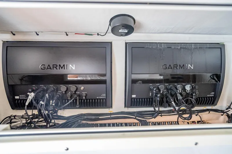 Slide: The Image of Garmin electronics setup on 2019 Freeman 42LR boat, featuring advanced navigation systems. - 52