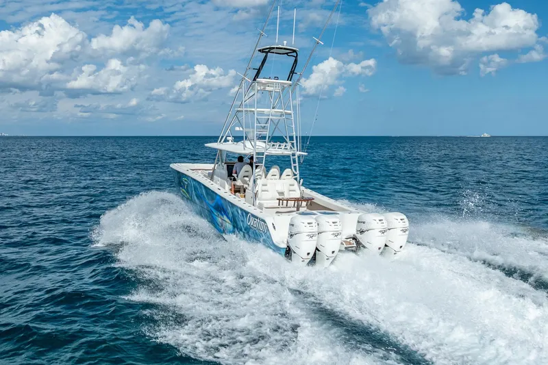 Slide: The Image of Aerial view of 2019 Freeman 42LR boat with multiple outboard engines on water. - 8