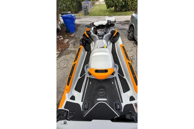 Slide: The Image of 2022 Sea-Doo FishPro Trophy 170 jet ski parked on a driveway. - 6