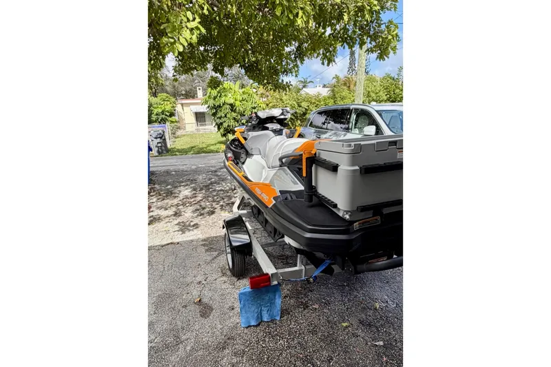 Slide: The Image of 2022 Sea-Doo FishPro Trophy 170 on trailer, parked under a tree. - 7