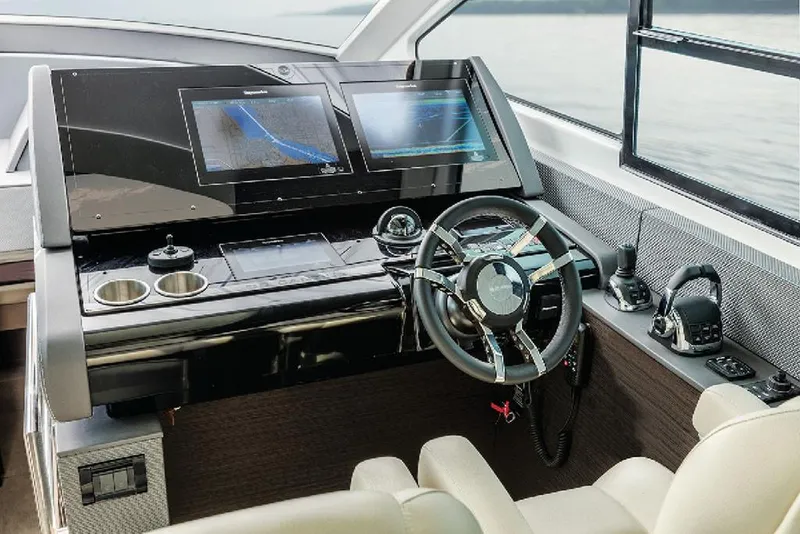 Slide: The Image of Manufacturer Provided Image: 2022 Cruisers Yachts 60 Cantius helm with modern navigation displays and controls. - 11