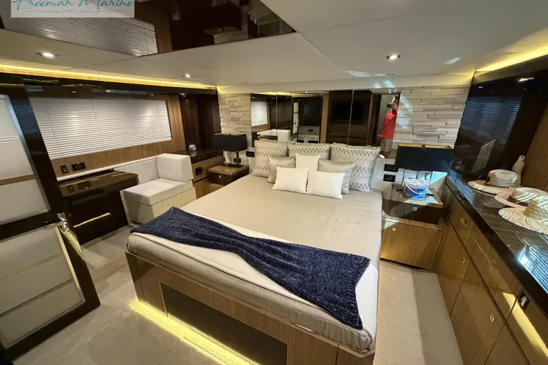 Slide: The Image of Luxurious 2022 Cruisers Yachts 60 Cantius bedroom with modern decor and ambient lighting. - 30