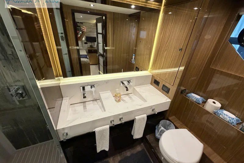 Slide: The Image of Luxurious bathroom in 2022 Cruisers Yachts 60 Cantius, featuring dual sinks and modern design. - 33