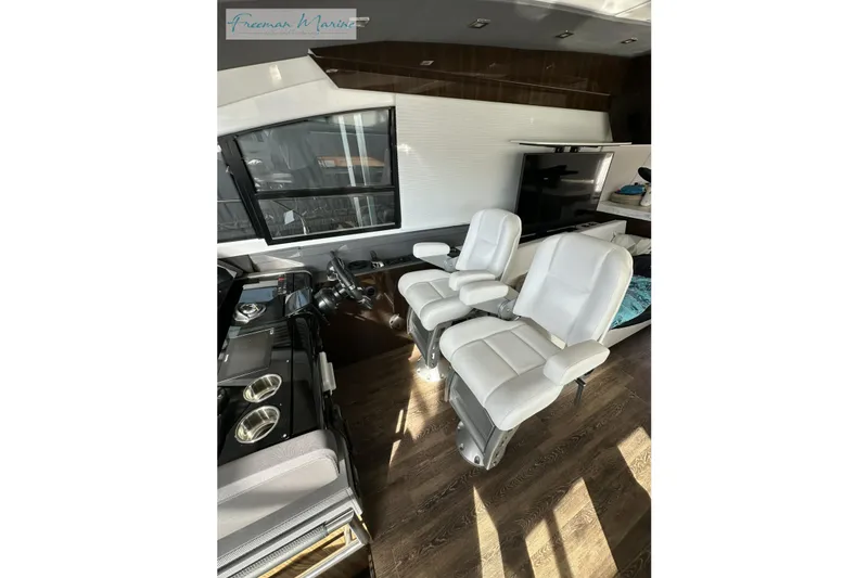 Slide: The Image of Interior of 2022 Cruisers Yachts 60 Cantius with luxurious seating and modern design. - 38