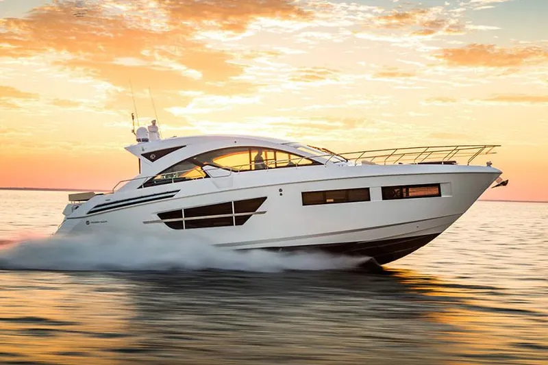 Slide: The Image of Manufacturer Provided Image: 2022 Cruisers Yachts 60 Cantius cruising at sunset on open water. - 4